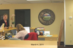 Quilt-reflected-in-medallion-mirror-in-hospice-office